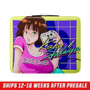 Square lunchbox with retro anime girl in pink shirt holding a game controller on a purple grid background.