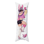 A long white body pillow featuring a printed anime-style bunny-themed character in pink, purple, black, and white, with a small matching bunny slipper graphic near the bottom.
